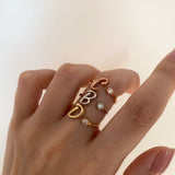 Custom initial ring in 925 sterling silver – accented with delicate stones