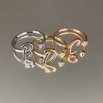 Custom initial ring in 925 sterling silver – accented with delicate stones